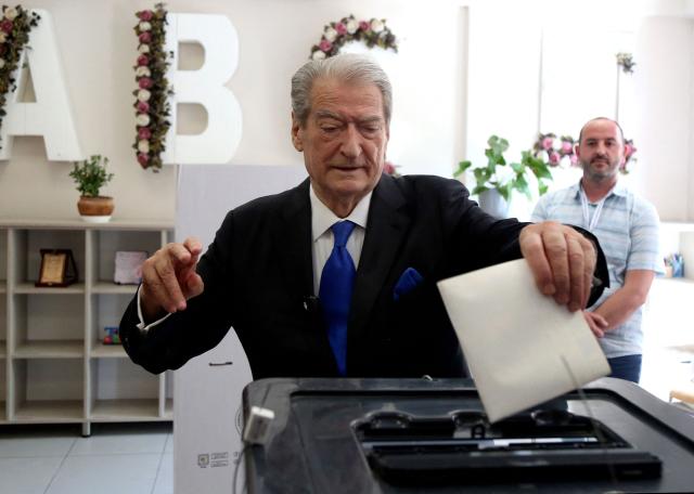 Chairman of the Democratic Party of Albania Sali Berisha casts his vote at a voting station in Tirana on May 11, 2025, during Albania's parliamentary election. Albanians head to the polls on May 11 to decide whether to give Prime Minister Edi Rama a fourth term or side with his longstanding rival in an election seen as crucial for the country's European Union ambitions. (Photo by STRINGER / AFP)