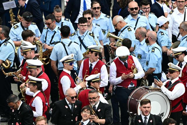 Members of a band gather prior to Pope Leo XIV's Regina Caeli prayer at St Peter's Square in The Vatican, on May 11, 2025. (Photo by Tiziana FABI / AFP)