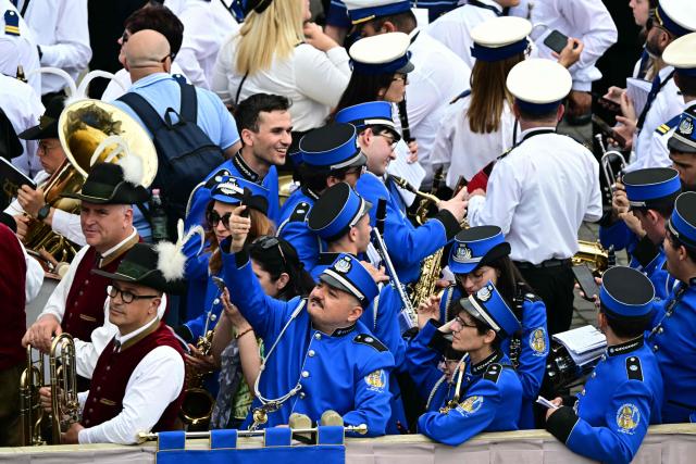 Members of a band gather prior to Pope Leo XIV's Regina Caeli prayer at St Peter's Square in The Vatican, on May 11, 2025. (Photo by Tiziana FABI / AFP)
