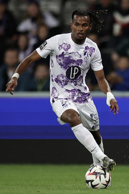 Toulouse's French forward #10 Yann Gboho runs with the ball during the French L1 football match between Toulouse FC and RC Lens at The TFC Stadium in Toulouse, southwestern France, on May 10, 2025. (Photo by Valentine CHAPUIS / AFP)