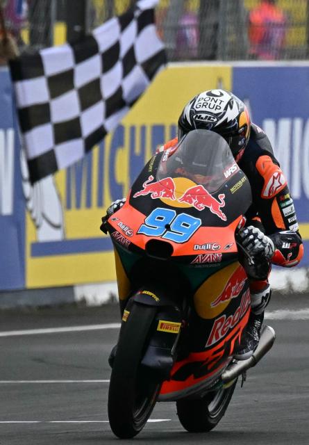 Red Bull KTM Tech3 team's Spanish Moto3 rider Jose Antonio Rueda crosses the finish line to win in the France Moto3 race at the Le Mans Circuit on May 11, 2025. (Photo by LOIC VENANCE / AFP)