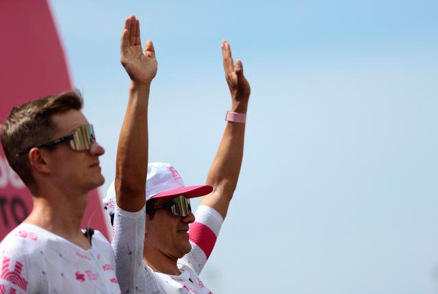 EF Education - EasyPost's Ecuadorian rider Richard Carapaz raises his arms during the presentation prior to the 3th stage of the 108th Giro d'Italia cycling race 160kms from Vlore to Vlore in Albania on May 11, 2025. (Photo by Luca Bettini / AFP)