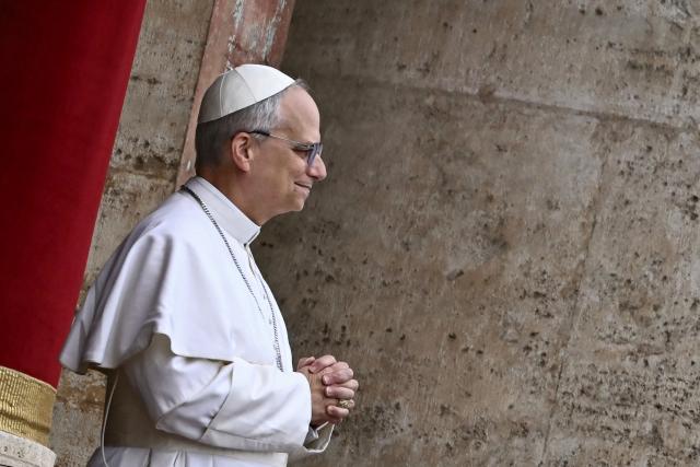 Pope Leo XIV delivers the Regina Caeli prayer from the main central loggia of St Peter's basilica in The Vatican, on May 11, 2025. (Photo by Filippo MONTEFORTE / AFP)