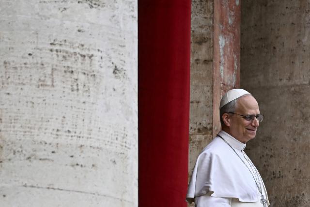 Pope Leo XIV reacts after delivering the Regina Caeli prayer from the main central loggia of St Peter's basilica in The Vatican, on May 11, 2025. (Photo by Filippo MONTEFORTE / AFP)