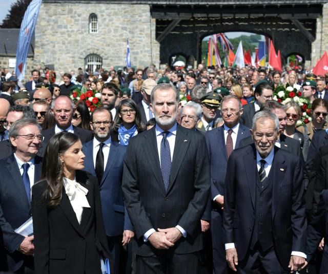 Spain's Queen Letizia, Spain's King Felipe VI and Austria's President Alexander van der Bellen attend the International Commemoration and Liberation Ceremony at the Memorial of the former concentration camp in Mauthausen, Austria, on May 11, 2025, on the 80th anniversary. (Photo by Hannes DRAXLER / various sources / AFP) / Austria OUT