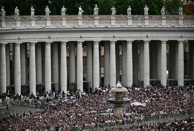 People attend the Regina Caeli prayer delivered by Pope Leo XIV at St Peter's Square in The Vatican, on May 11, 2025. (Photo by Filippo MONTEFORTE / AFP)
