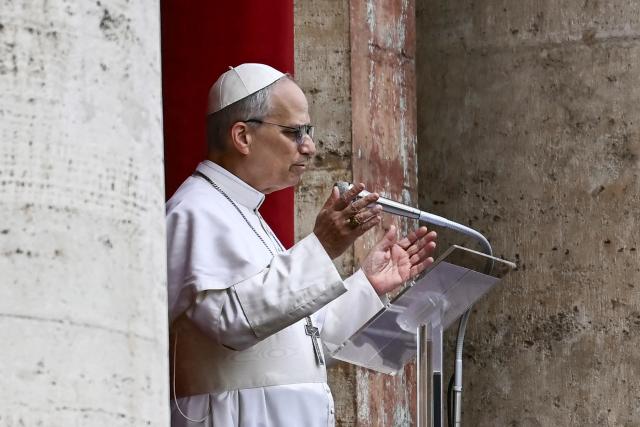 Pope Leo XIV delivers the Regina Caeli prayer from the main central loggia of St Peter's basilica in The Vatican, on May 11, 2025. (Photo by Filippo MONTEFORTE / AFP)