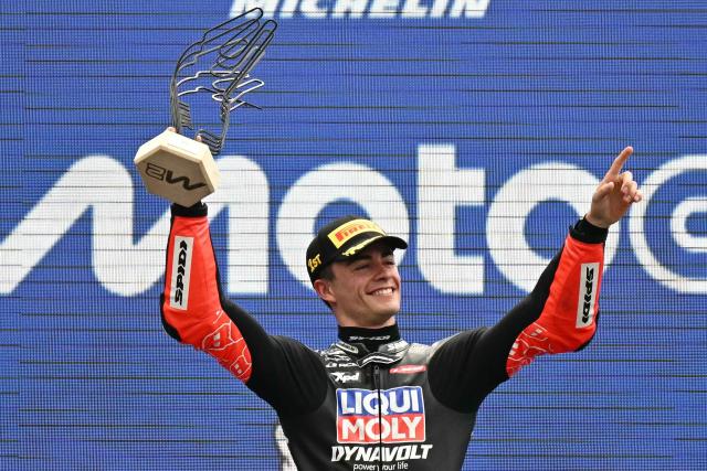 Winner Liqui Moly Dynavolt Itact GP team's Spanish Moto2 rider Manuel Gonzalez, celebrates on the podium after the France Moto2 race at the Le Mans Circuit on May 11, 2025. (Photo by LOIC VENANCE / AFP)