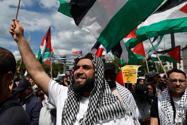 A protester wearing a keffiyeh takes part in a rally against Islamophobia, in Paris on May 11, 2025. Various organizations and public figures called for a march in Paris on May 11, 2025 to condemn “the rise of Islamophobia in France” and pay tribute to Aboubakar Cissй, a young man killed in a mosque in the Gard region on April 25. (Photo by GEOFFROY VAN DER HASSELT / AFP)