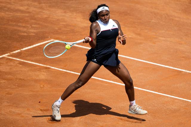 USA’s Coco Gauff plays a forehand return to Poland’s Magda Linette during their women's singles match of the WTA Rome Open tennis tournament at Foro Italico in Rome on May 11, 2025. (Photo by MARCO BERTORELLO / AFP)