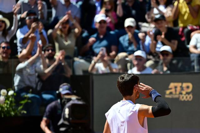 Italy's Lorenzo Musetti celebrates after winning the men's singles match against US' Brandon Nakashima during the ATP Rome Open tennis tournament at Foro Italico in Rome on May 11, 2025. (Photo by PIERO CRUCIATTI / AFP)