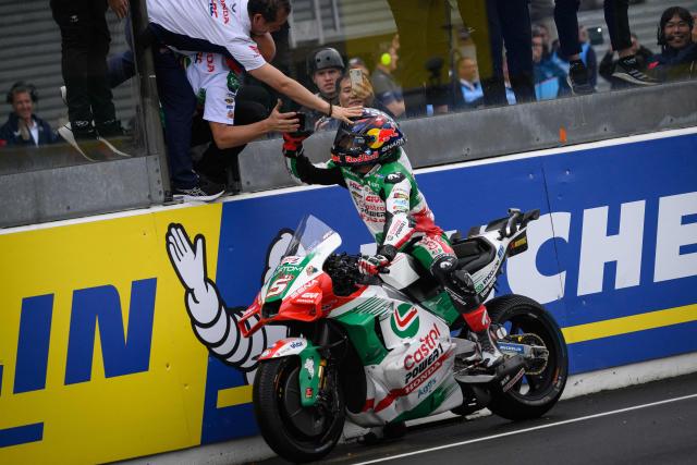 LRC Honda team's French MotoGP rider Johann Zarco celebrates with teammates after winning in the France Moto GP Sprint race at the Le Mans Circuit on May 11, 2025.  (Photo by Loic VENANCE / AFP)