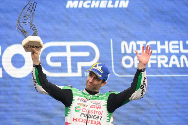 LCR Honda team's French MotoGP rider Johann Zarco celebrates on the podium after winning the France Moto GP race at the Le Mans Circuit on May 11, 2025. (Photo by Loic VENANCE / AFP)