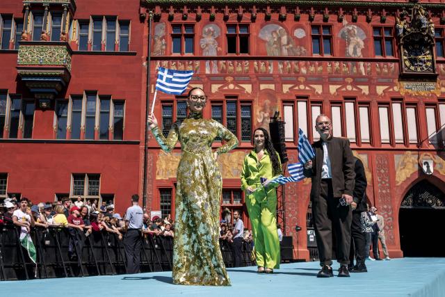 Greek singer Klavdia representing Greece with the song "Asteromata" poses on the turquoise carpet next to the Basel Town Hall during the opening ceremony of the Eurovision Song Contest 2025 in Basel on May 11, 2025. (Photo by Fabrice COFFRINI / AFP)