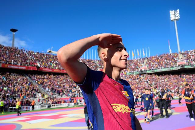 Barcelona's Spanish midfielder #16 Fermin Lopez celebrates victory at the end of the Spanish league football match between FC Barcelona and Real Madrid CF at Estadi Olimpic Lluis Companys in Barcelona, on May 11, 2025. Barcelona won 4-3. (Photo by Josep LAGO / AFP)