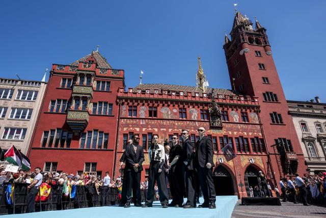 Norwegian singer Kyle Alessandro (C) representing Norway with the song "Lighter" poses on the turquoise carpet next to the Basel Town Hall during the opening ceremony of the Eurovision Song Contest 2025 in Basel on May 11, 2025. (Photo by Fabrice COFFRINI / AFP)