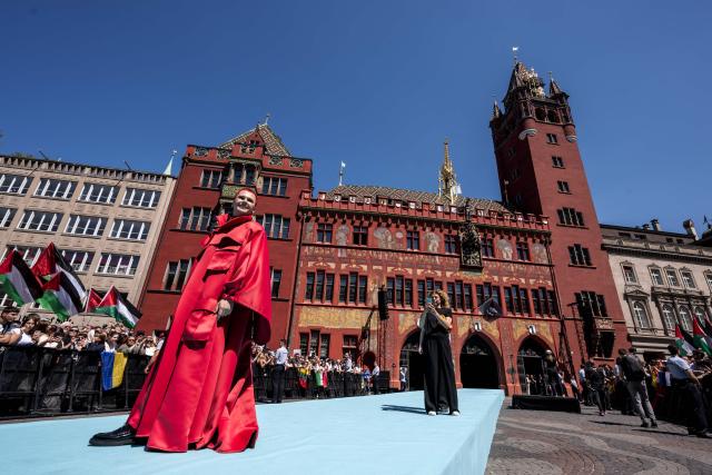 Belgian singer Red Sebastian representing Belgium with the song "Strobe Lights" poses on the turquoise carpet next to the Basel Town Hall during the opening ceremony of the Eurovision Song Contest 2025 in Basel on May 11, 2025. (Photo by Fabrice COFFRINI / AFP)