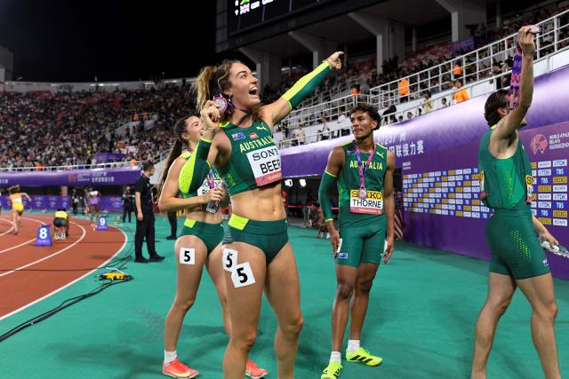 Australia's Ellie Beer celebrates with her teammates after winning second place in the mix's 4x400m relay final of the World Athletics Relays Guangzhou25 in Guangzhou, China’s Guangdong province on May 11, 2025. (Photo by WANG Zhao / AFP)