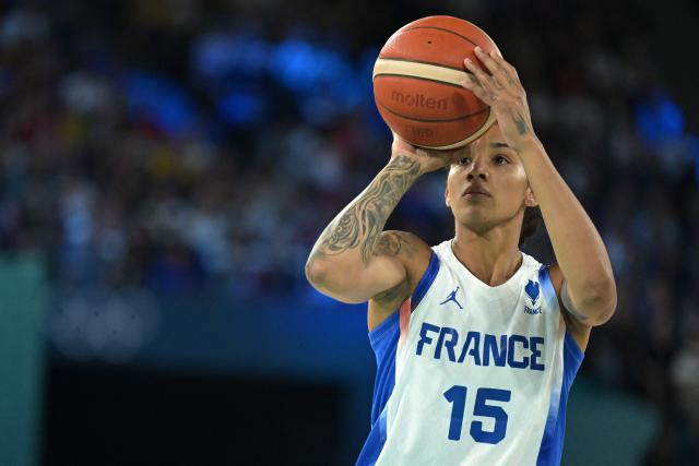 (FILES) France's #15 Gabby Williams takes a free throw in the women's semifinal basketball match between France and Belgium during the Paris 2024 Olympic Games at the Bercy Arena in Paris on August 9, 2024. The star winger of the French women's basketball team, Gabby Williams, announced on May 11, 2025, that she would not be taking part in the Euro-2025 basketball tournament starting this upcoming June 18th, that France's "Les Bleues" will be playing in Greece. "It's a personal choice that I haven't taken lightly, and I'll remain the first supporter of the French team", the 28-year-old wrote on Instagram, without saying whether her decision was linked to the constraints of her contract in the WNBA, the North American basketball league. (Photo by Damien MEYER / AFP)
