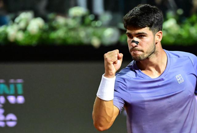 Spain's Carlos Alcaraz reacts during his men's singles match against Serbia's Laslo Djere at the ATP Rome Open tennis tournament at Foro Italico in Rome on May 11, 2025. (Photo by PIERO CRUCIATTI / AFP)