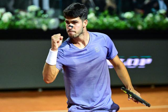 Spain's Carlos Alcaraz reacts during his men's singles match against Serbia's Laslo Djere at the ATP Rome Open tennis tournament at Foro Italico in Rome on May 11, 2025. (Photo by PIERO CRUCIATTI / AFP)