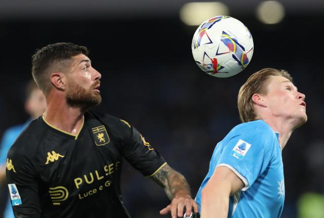 Napoli's Scottish midfielder #8 Scott McTominay fights for the ball with Genoa's Italian defender #20 Stefano Sabelli during the Italian Serie A football match SSC Napoli vs Genoa CFC at Diego Armando Maradona Stadium in Naples, on May 11, 2025. (Photo by CARLO HERMANN / AFP)
