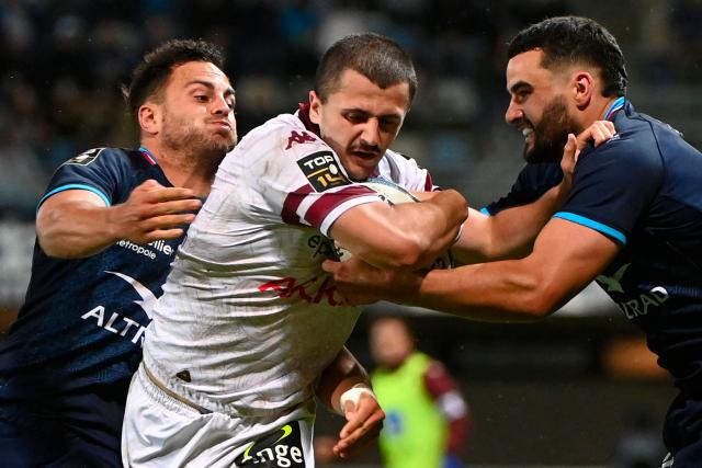 Bordeaux-Begles' French wing Jon Echegaray (C) runs to score a try during the French Top14 rugby union match between Montpellier Herault Rugby and Bordeaux-Begles (UBB) at the GGL Stadium in Montpellier, southern France on May 11, 2025. (Photo by Sylvain THOMAS / AFP)