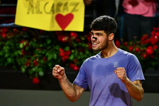 Spain's Carlos Alcaraz celebrates after winning his men's singles match against Serbia's Laslo Djere during the ATP Rome Open tennis tournament at Foro Italico in Rome on May 11, 2025. (Photo by PIERO CRUCIATTI / AFP)