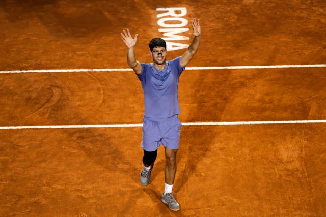TOPSHOT - Spain's Carlos Alcaraz celebrates after winning his men's singles match against Serbia's Laslo Djere during the ATP Rome Open tennis tournament at Foro Italico in Rome on May 11, 2025. (Photo by MARCO BERTORELLO / AFP)