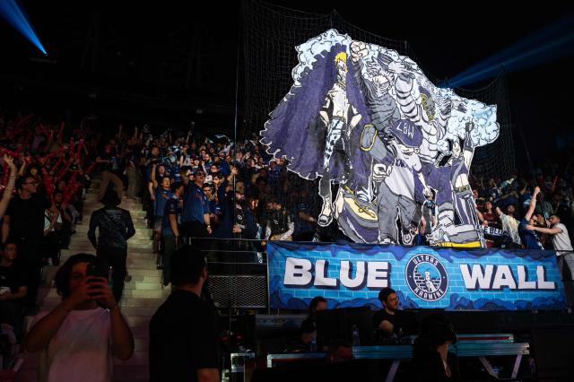 Karmine Corp's supporters cheer as they attend the League of Legends EMEA Championship (LEC) Roadtrip - eSports competition at Les Arenes in Evry-Courcouronnes, suburb of Paris,  on May 11, 2025. (Photo by Leo VIGNAL / AFP)