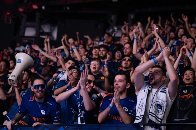 Karmine Corp's supporters cheer as they attend the League of Legends EMEA Championship (LEC) Roadtrip - eSports competition at Les Arenes in Evry-Courcouronnes, suburb of Paris,  on May 11, 2025. (Photo by LEO VIGNAL / AFP)