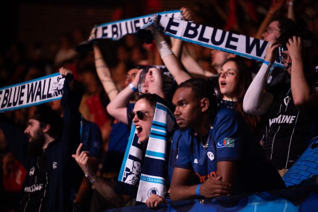 Karmine Corp's supporters cheer as they attend the League of Legends EMEA Championship (LEC) Roadtrip - eSports competition at Les Arenes in Evry-Courcouronnes, suburb of Paris,  on May 11, 2025. (Photo by Leo VIGNAL / AFP)