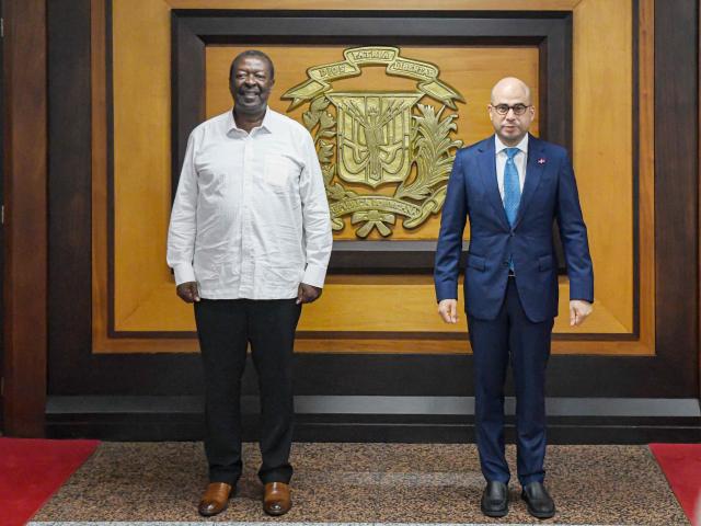 Kenyan Prime Cabinet Secretary and Cabinet Secretary for Foreign Affairs Musalia Mudavadi (L) and Dominican Republic's Vice Minister of Bilateral Foreign Policy Francisco Caraballo pose for a picture during a meeting in Santo Domingo on May 11, 2025. (Photo by Eddy Vittini / AFP)