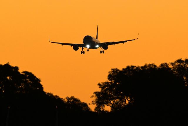 An airplane lands at Jorge Newbery Airport in Buenos Aires on May 11, 2025. (Photo by JUAN MABROMATA / AFP)
