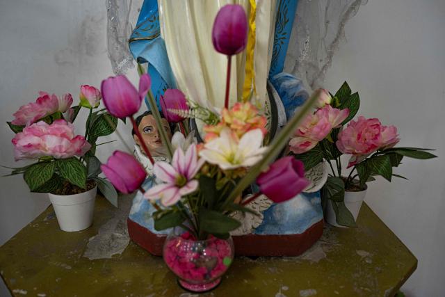 View of a detail of a religious image at the chapel devoted to the Divino Nino del Milagro (Divine Child of the Miracle), in Eten district, Lambayeque region, northern Peru, on May 10, 2025.reported in Peru. In the small town of Eten the faithful flock every year to celebrate the miracle of the Divine Child, a sacred phenomenon not yet recognised by the Vatican. The election of Leo XIV, former bishop of the diocese, has revived hopes for official recognition, as well as for the construction of a sanctuary worthy of this Eucharistic miracle, the only one of its kind reported in Peru. (Photo by ERNESTO BENAVIDES / AFP)