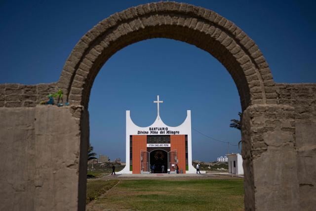 View of the entrance to the chapel devoted to the Divino Nino del Milagro (Divine Child of the Miracle) in the Eten district, Lambayeque region, northern Peru on May 10, 2025. In the small town of Eten the faithful flock every year to celebrate the miracle of the Divine Child, a sacred phenomenon not yet recognised by the Vatican. The election of Leo XIV, former bishop of the diocese, has revived hopes for official recognition, as well as for the construction of a sanctuary worthy of this Eucharistic miracle, the only one of its kind reported in Peru. (Photo by ERNESTO BENAVIDES / AFP)