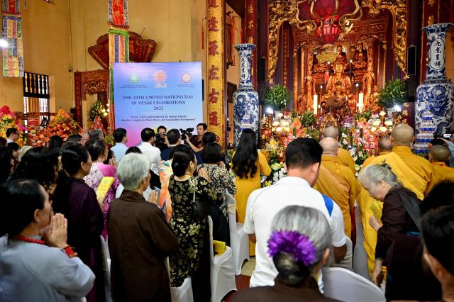 Buddhist devotees pray at the Quan Su Pagoda in Hanoi on May 12, 2025, as Buddhists celebrated Vesak Day, or Buddha Day, which marks the Buddha's birth. (Photo by Nhac NGUYEN / AFP)
