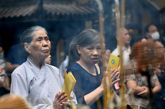 Buddhist devotees pray at the Quan Su Pagoda in Hanoi on May 12, 2025, as Buddhists celebrated Vesak Day, or Buddha Day, which marks the Buddha's birth. (Photo by Nhac NGUYEN / AFP)