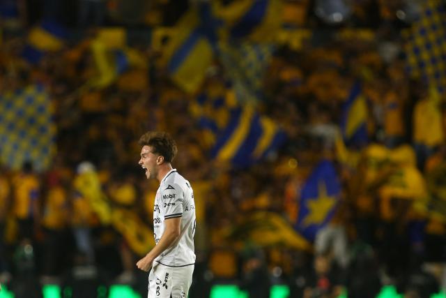 Necaxa's midfielder #08 Agustin Palavecino celebrates after scoring his team's first goal during the Liga MX Clausura tournament quarter-final second leg football match between Tigres and Necaxa at the UANL University Stadium in San Nicolás de los Garza, Nuevo Leon state, Mexico on May 11, 2025. (Photo by Julio Cesar AGUILAR / AFP)