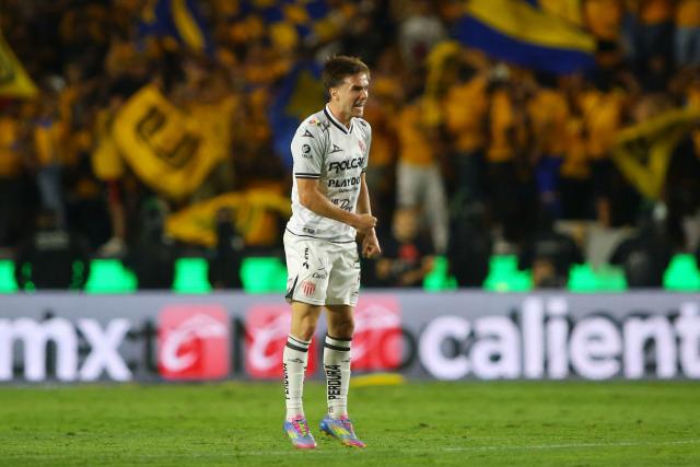 Necaxa's midfielder #08 Agustin Palavecino celebrates after scoring his team's first goal during the Liga MX Clausura tournament quarter-final second leg football match between Tigres and Necaxa at the UANL University Stadium in San Nicolás de los Garza, Nuevo Leon state, Mexico on May 11, 2025. (Photo by Julio Cesar AGUILAR / AFP)
