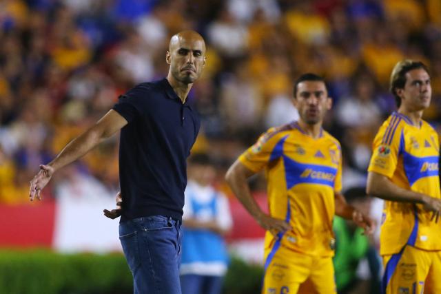 Tigres' Argentine coach Guido Pizarro (L) gestures during the Liga MX Clausura tournament quarter-final second leg football match between Tigres and Necaxa at the UANL University Stadium in San Nicolás de los Garza, Nuevo Leon state, Mexico on May 11, 2025. (Photo by Julio Cesar AGUILAR / AFP)