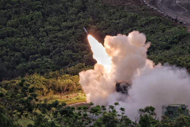 The Taiwanese military conducts its first High Mobility Artillery Rocket System(HIMARS) live-fire test launch at the Jiupeng base in Pingtung on May 12, 2025. (Photo by I-Hwa Cheng / AFP)