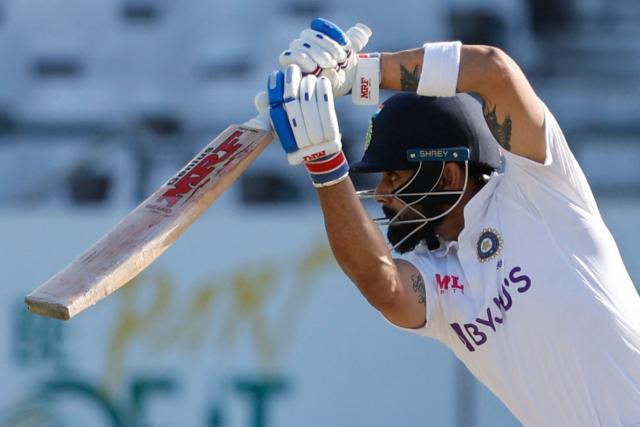 (FILES) India's Virat Kohli watches the ball after playing a shot during the second day of the third Test cricket match between South Africa and India at Newlands stadium in Cape Town on January 12, 2022. Batting great Kohli announced his immediate retirement from Test cricket on May 12, 2025, just days before India name their squad for a tour to England. (Photo by Marco Longari / AFP)