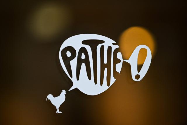 (FILES) This photograph shows the logo of French cinema group Pathe Gaumont in Paris on January 20, 2025. It was announced on May 12, 2025, by Pathe the French cinema giant a leader in film production and cinema operations in Europe and Africa, that the Saade family has acquired a 20% stake in the Pathe group through its holdings in Merit France. (Photo by Julie SEBADELHA / AFP)