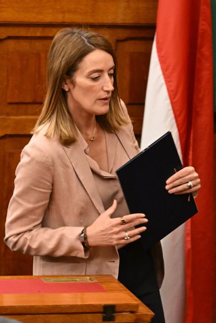 European Parliament President Roberta Metsola leaves after addressing this audience during the opening of the 'Conference of Speakers of the European Union Parliaments' in the parliament building in Budapest, Hungary, on May 12, 2025. The Conference of Speakers of European Union Parliaments is the highest forum for cooperation between European national parliaments, with the main function of defining the framework and strategic goals for interparliamentary cooperation. (Photo by Attila KISBENEDEK / AFP)