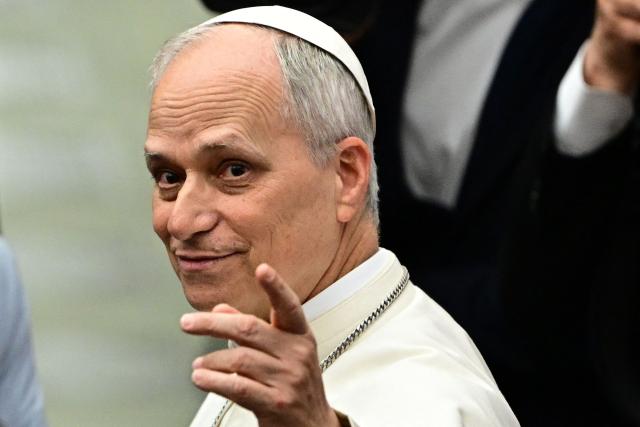 Pope Leo XIV gestures during an audience to representatives of the media, at Paul-VI hall in The Vatican, on May 12, 2025. (Photo by Tiziana FABI / AFP)