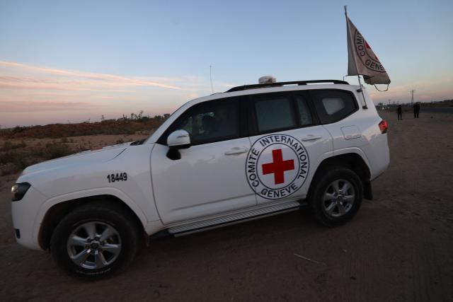An International Red Cross (ICRC) vehicle drives in Deir el-Balah as it transports US-Israeli hostage Edan Alexander on May 12, 2025, after being handed over by Al-Qassam Brigades. Palestinian militant group Hamas said its armed wing handed over a US-Israeli hostage held in Gaza since October 2023 on Monday, ahead of a regional visit by US President Donald Trump. (Photo by Eyad BABA / AFP)