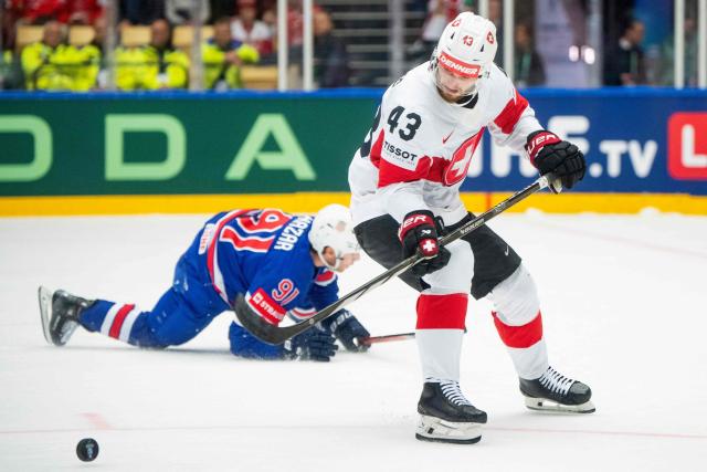 Switzerland's defender #43 Andrea Glauser and US forward #91 Frank Nazar vie for the puck during the IIHF Men's Ice Hockey World Championship match between USA and Switzerland in Herning, on May 12, 2025. (Photo by Bo Amstrup / Ritzau Scanpix / AFP) / Denmark OUT