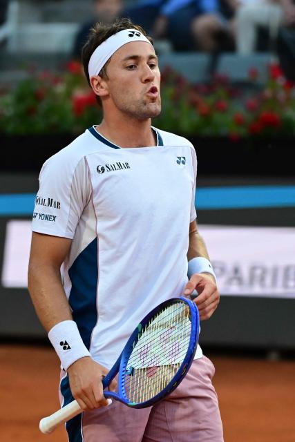 Norway's Casper Ruud reacts during the men's singles match against Italy's Matteo Berrettini at the ATP Rome Open tennis tournament at Foro Italico in Rome on May 12, 2025. (Photo by PIERO CRUCIATTI / AFP)
