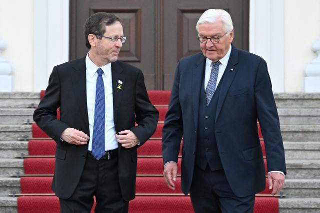 German President Frank-Walter Steinmeier (R) and Israeli President Isaac Herzog pose ahead a gala dinner on May 12, 2025 at the Bellevue Palace in Berlin. Israeli President Isaac Herzog is visiting Germany to mark the 60th anniversary of diplomatic relations between the two countries. (Photo by RALF HIRSCHBERGER / AFP)